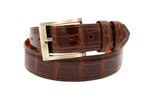 Glazed Cognac Alligator leather belt with a gold buckle on a white background