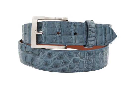 Blue crocodile-patterned belt with a silver buckle on a white background