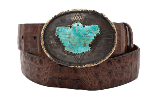 Brown belt with a turquoise Thunderbird and silver buckle on a white background
